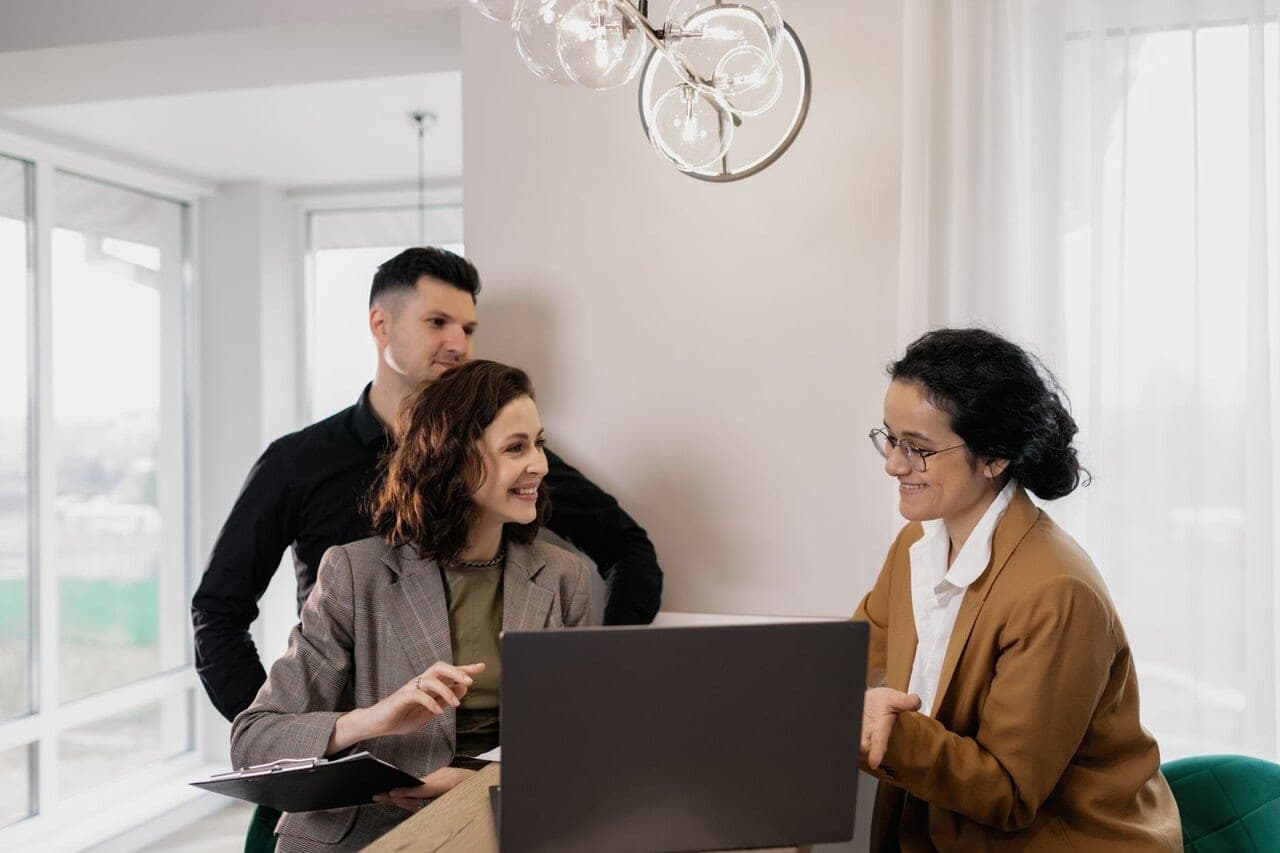 Borrowers discussing financing with an advisor